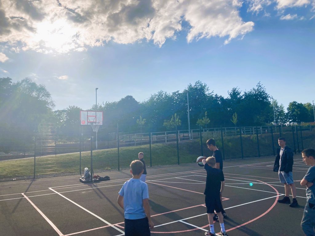 Young People playing Basketball